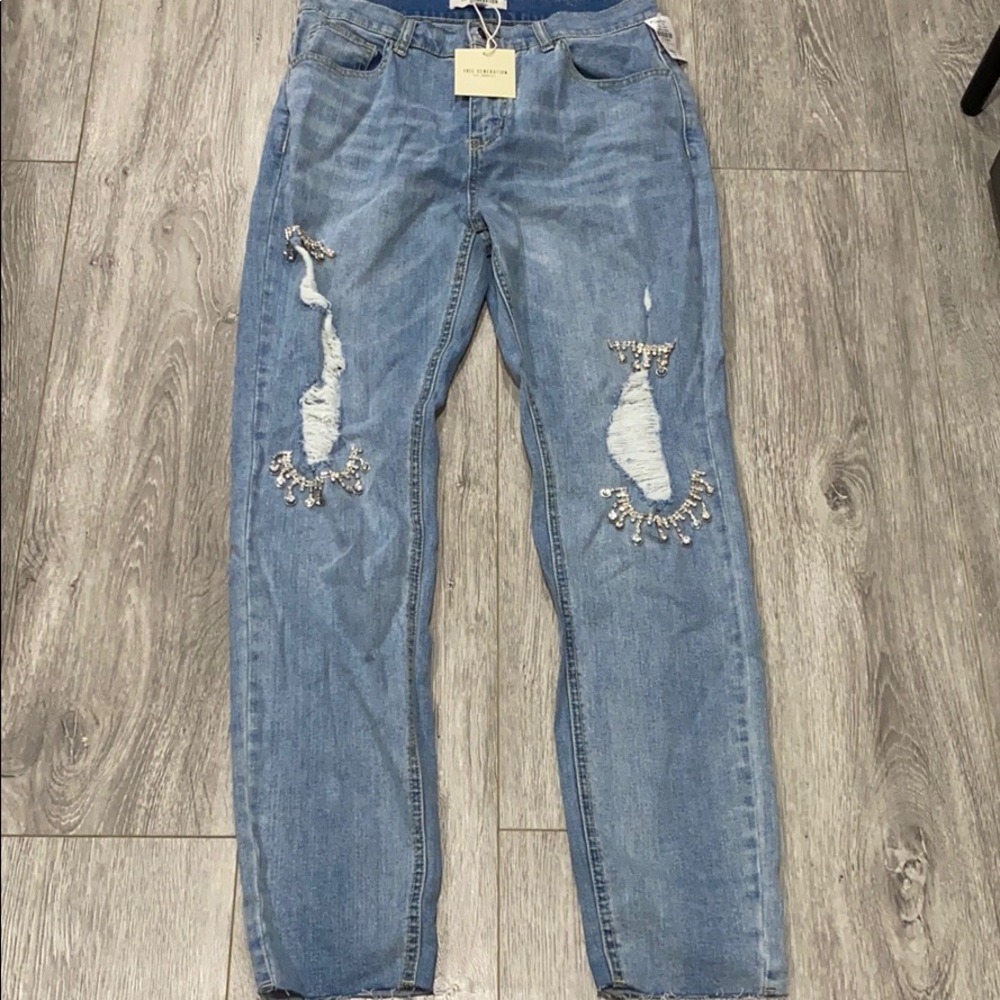 Light washed destroyed crystal jeans